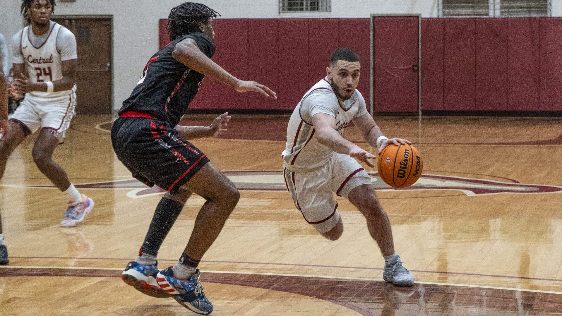 CCCB junior Sonny Amabile drives to the basket during a game from the 2023-24 season. Amabile had four points in the Saints' 113-103 loss to Spurgeon on Friday.
